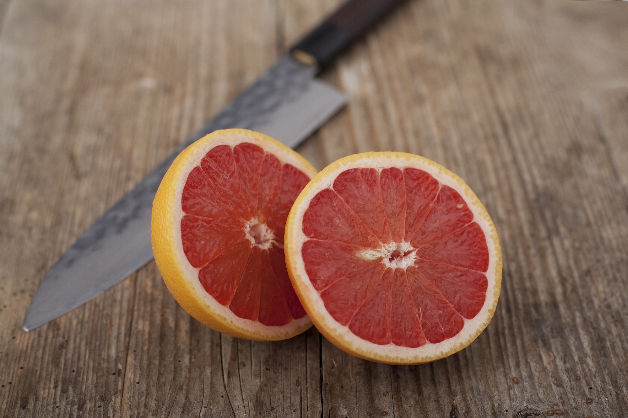 Grapefruits on wooden surface